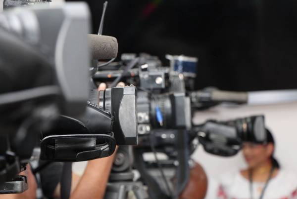 Filming setup in a press setting